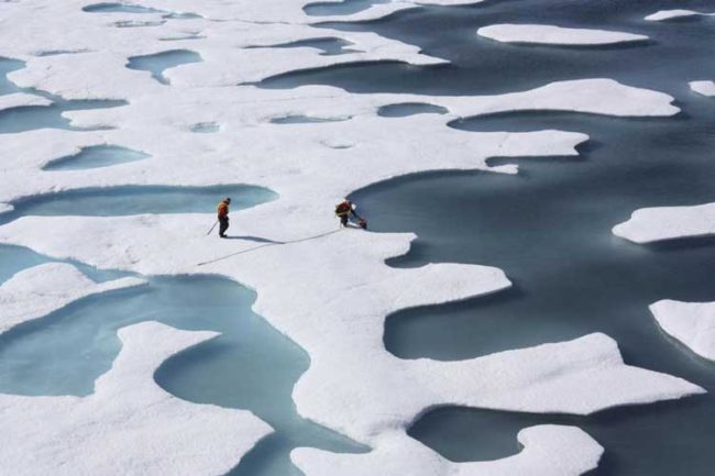 The crew of the US Coast Guard Cutter Healy, in the midst of their ICESCAPE mission, retrieves supplies in the Arctic Ocean Kathryn Hansen/NASA via REUTERS/File Photo
